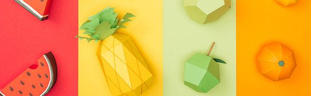 panoramic shot of various origami fruits on colorful paper stripes - 写真・画像