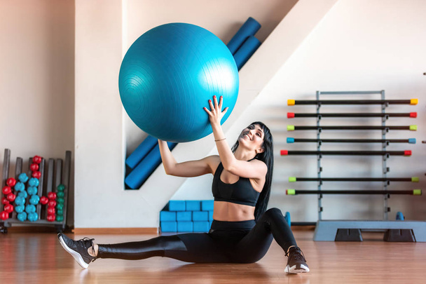 Fitness woman exercise with ball in gym. Individual sport to fit muscles of body for healthy life concept. - Foto, Bild