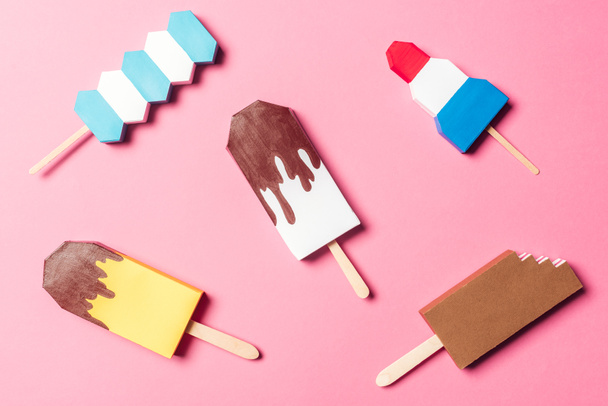 top view of various handmade colorful origami ice cream on pink - Φωτογραφία, εικόνα
