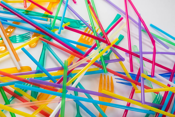 Dangerous and harmful bright straws being thrown on the floor - Foto, Imagem