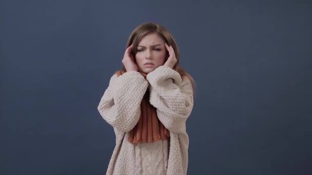 Sick girl wrapped in a warm scarf suffering from nose and headache - Filmmaterial, Video