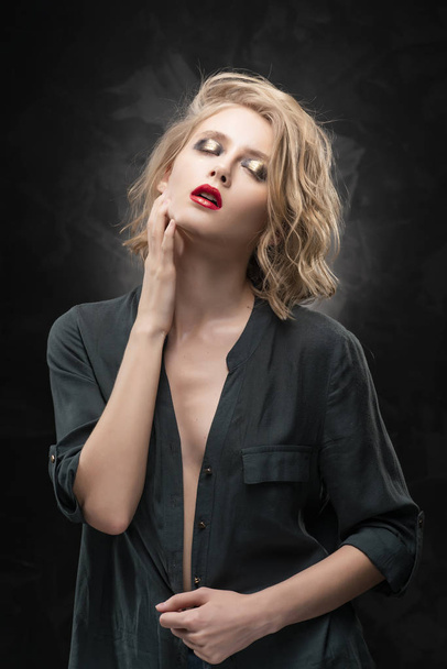 Beautiful young braless slim blonde girl with disheveled hair an - 写真・画像