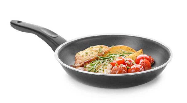 Frying pan with tasty baked potato on white background - Fotó, kép