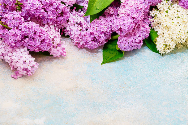 Floral pattern of pink lilac branches, flowers background. Flat lay, top view. - Photo, Image