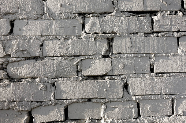 Old brick wall pattern of white color of modern design style decorative uneven. Close-up. - Foto, immagini