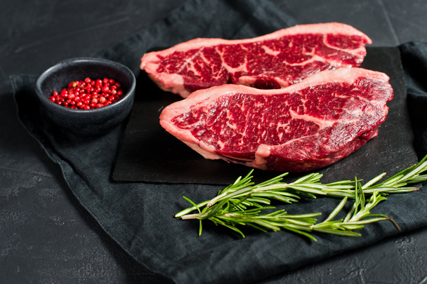 Raw beef ramp steak. Black background, top view. - Photo, Image