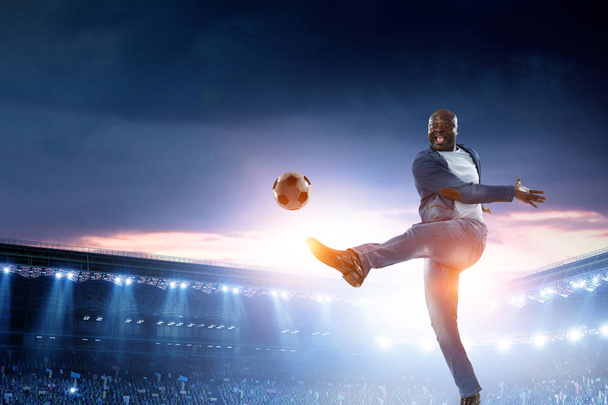 Black man plays his best soccer match. Mixed media - Фото, изображение