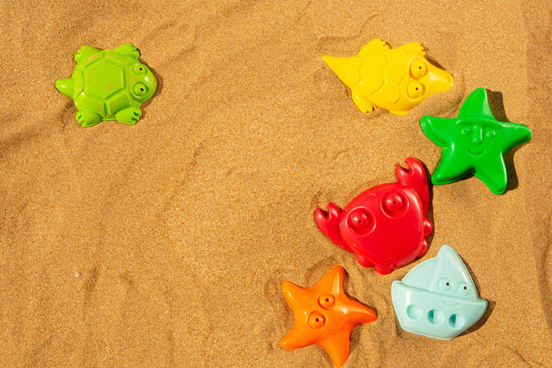 Toys on beach - Фото, изображение