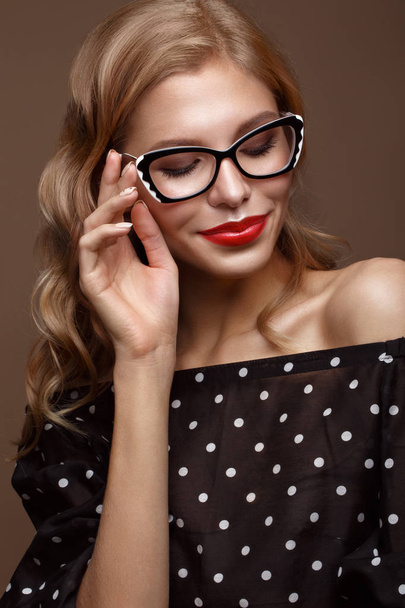 Beautiful girl in stylish clothes with glasses for vision and red sexy lips. - Фото, изображение