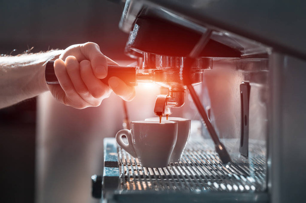 coffee making process; espresso cup and machine; - 写真・画像