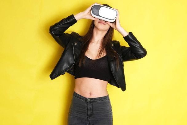 Woman wearing VR goggles. Full of expression. - Photo, Image
