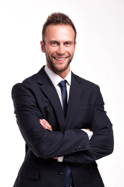 smiling businessman over a white background - Фото, зображення