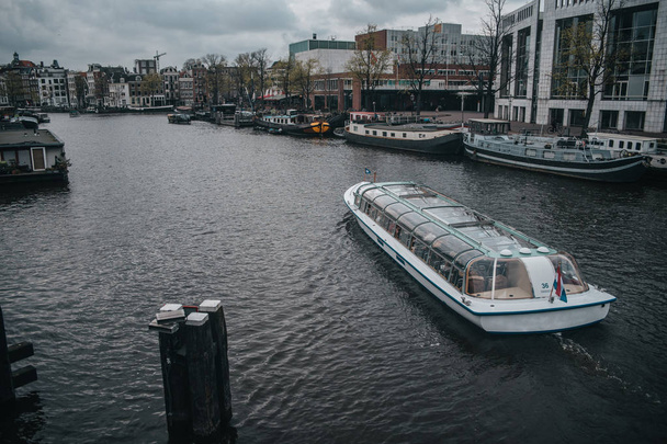 Amsterdam river tram with tourist sightseeing at the central riv - Fotó, kép