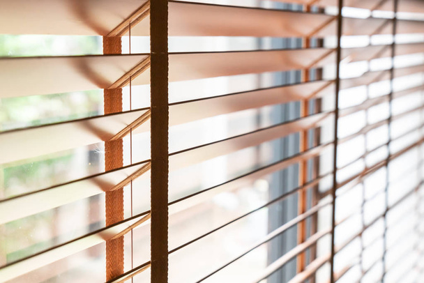 Wooden shutters on the window in the living room - 写真・画像