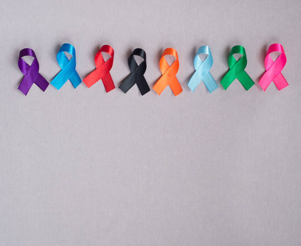 Different ribbons, symbols of cancer, cancer awareness month.  Copy space for your text.  - Photo, Image