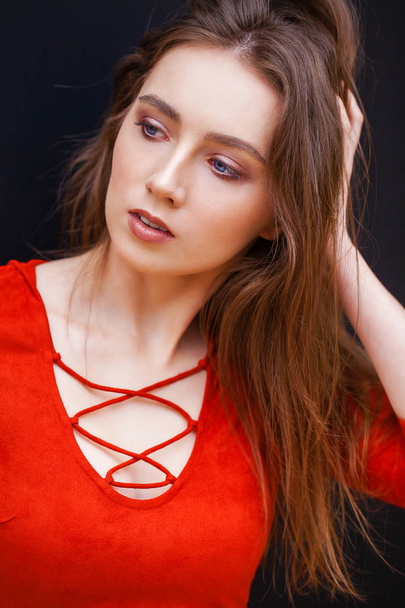 Young beautiful brunette model in red dress - Foto, Bild