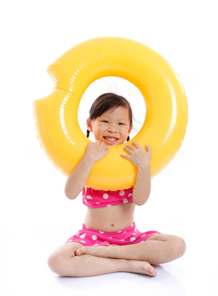 Little asian girl in swim suit  smiling. - Фото, изображение