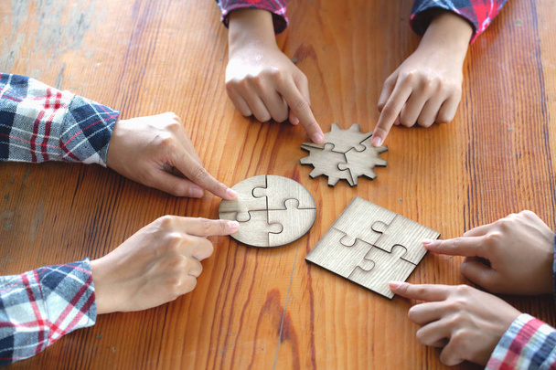 Many persons holding pieces of jigsaw puzzle,Teamwork concept,,Business connection,Success and strategy concept,Business accounting - Fotografie, Obrázek
