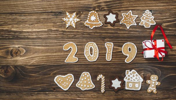 Collection of homemade christmas cookies with gift on wooden background  - Photo, Image