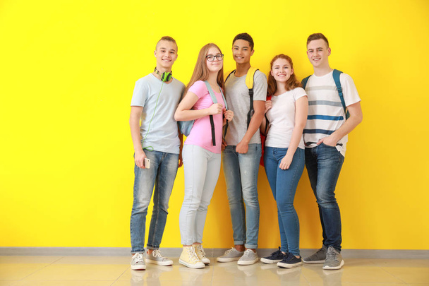 Group of teenagers near color wall - Photo, Image