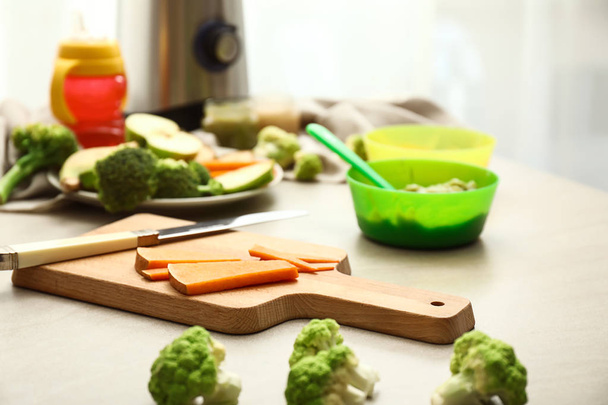 Ingredients for healthy baby food on kitchen table - Photo, Image