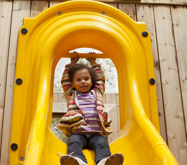 child playing on a slide - Photo, Image
