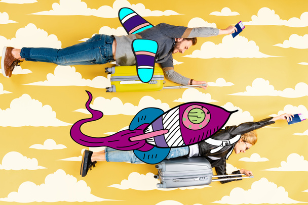 happy couple flying as rockets in sky on suitcases with passports and air tickets on yellow background with clouds illustration - Photo, Image