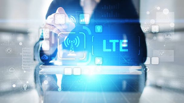 Concepto de banda LTE, internet móvil y tecnología de telecomunicaciones en pantalla virtual. - Foto, imagen