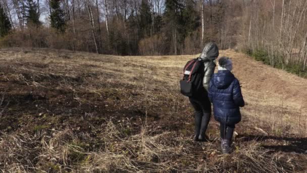  Mother and daughter go down to the hill.Hiking concept - Footage, Video