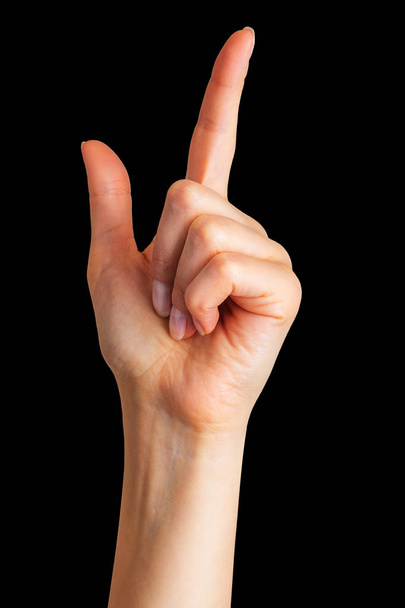 Женщина с указательным пальцем, указывающим вверх - Фото, изображение
