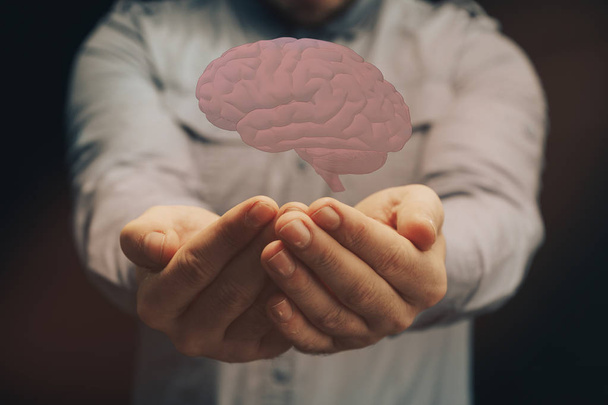 Un humain tenant son cerveau dans la paume. Techniques mixtes. Technologies innovantes
. - Photo, image