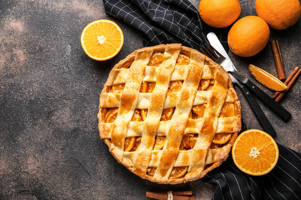 Tasty orange pie on grunge background - Photo, Image
