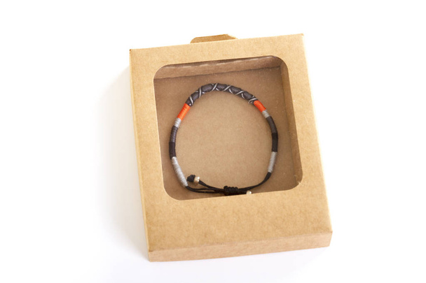 close up view of colorful bracelet in cardboard paper box - Photo, Image