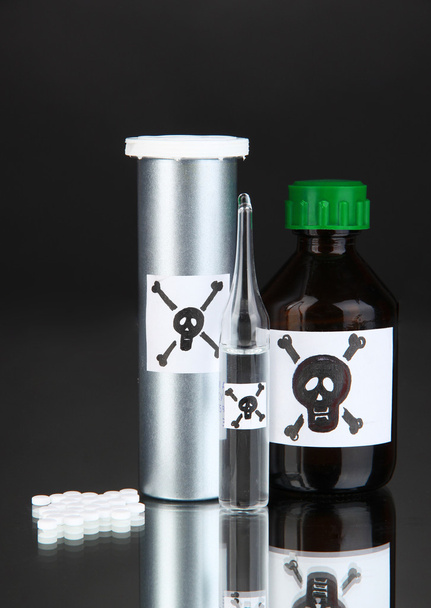 Deadly poison in bottles on black background - Fotoğraf, Görsel