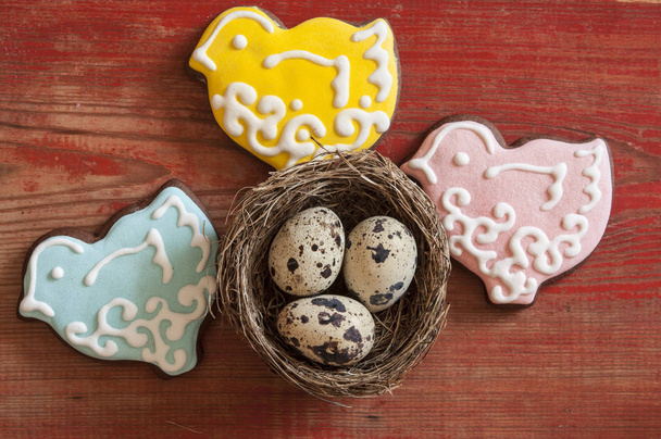 Colorful easter cookies on a wooden background - Photo, Image
