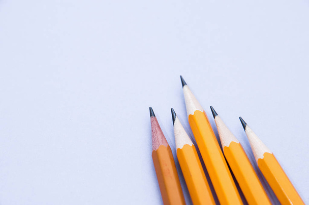 five simple pencils on a lilac background with a copy space. selective focus - Foto, immagini