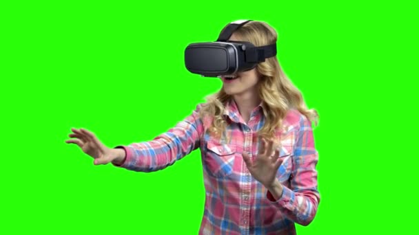 Young woman wearing virtual reality glasses - Footage, Video