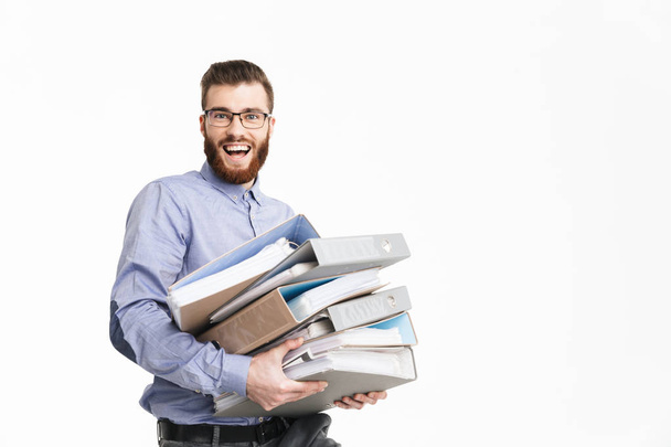 Happy bearded elegant man in eyeglasses holding folders - Photo, Image