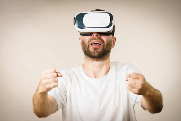 Adult man wearing vr goggles - Photo, image