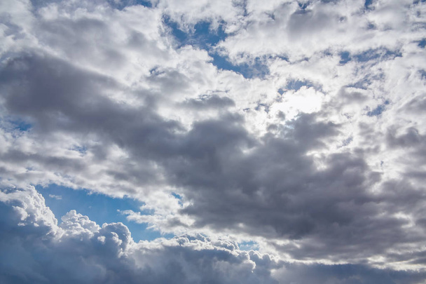 Sun shines through the overcast sky in cloudy weather - image, photo - Zdjęcie, obraz