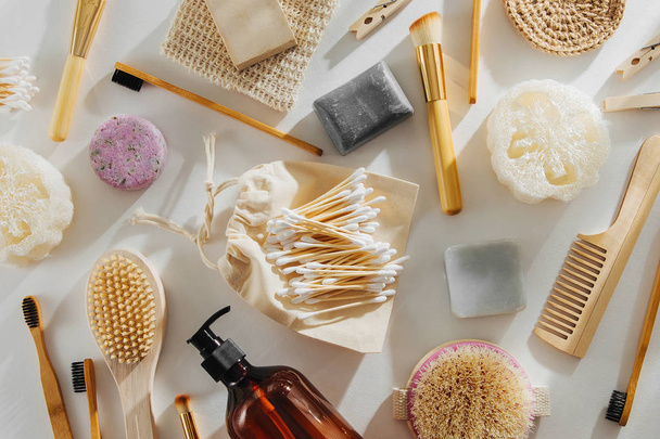 Set of Eco cosmetics products and tools. Soap, Shampoo Bottles, bamboo toothbrush, natural wooden brush. Zero waste, Plastic free. Sustainable lifestyle concept.  - 写真・画像