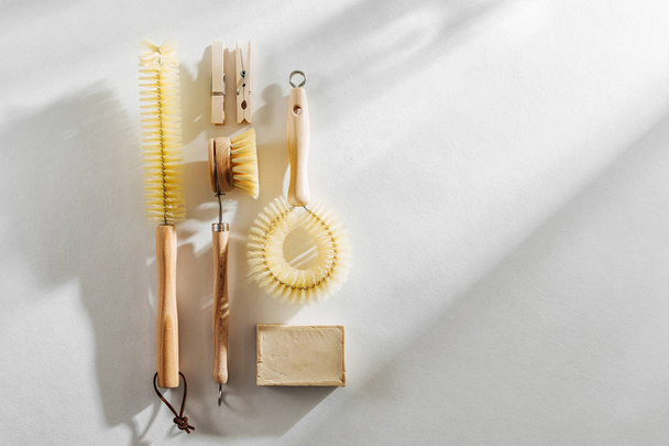 Dish washing brushes on white background. Zero waste concept. Plastic free. Flat lay, top view - Фото, зображення