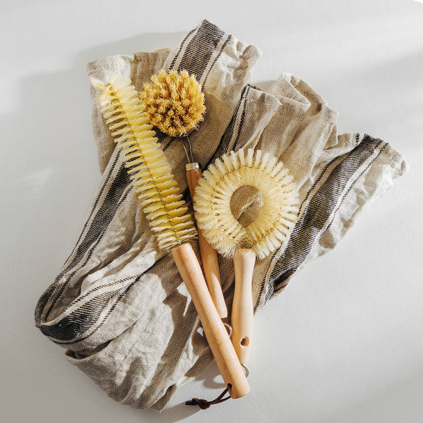 Dish washing brushes on white background. Zero waste concept. Plastic free. Flat lay, top view - Фото, зображення
