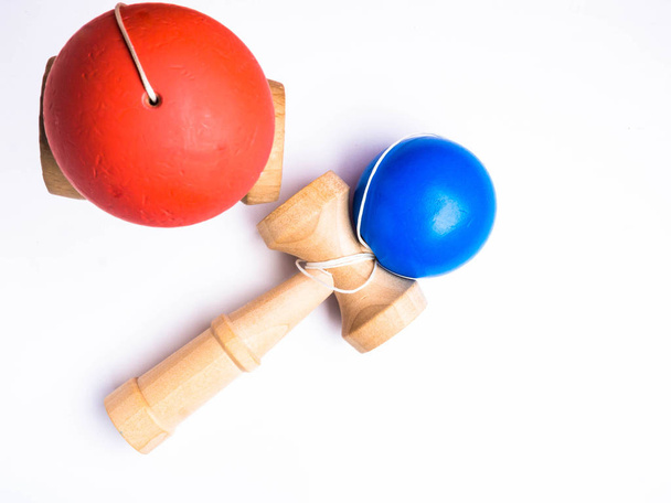 red and blue Kendama japanese toys, isolated on white, competition concept - Фото, изображение