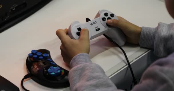 Player s fingers are controlling the computer game by pressing the buttons of the joystick - 映像、動画
