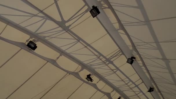 white fabric roof over the street stadium in the city center - Materiał filmowy, wideo