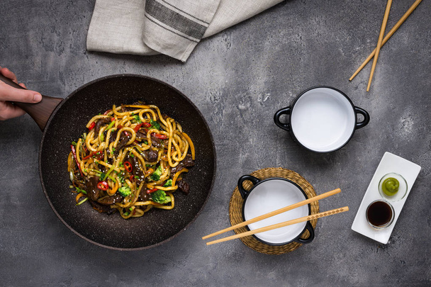 Udon Stir-Fry Noodles with Beef and Vegetables in Wok Pan on Dar - Photo, Image