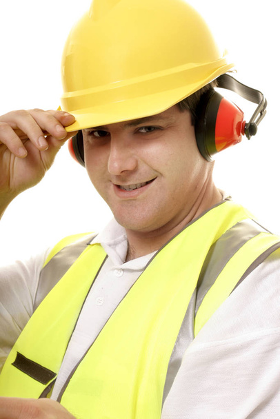 Friendly tradesmen tips his hat - Photo, image