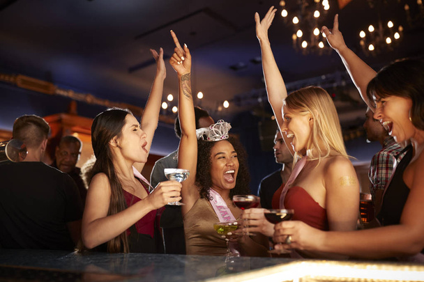 Group Of Dancing Female Friends Celebrating With Bride On Hen Party In Bar - Fotoğraf, Görsel
