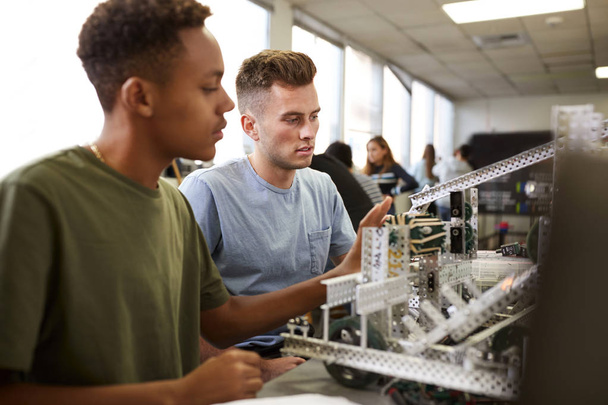 Two Male University Students Building Machine In Science Robotics Or Engineering Class - Valokuva, kuva
